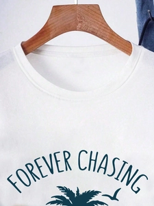Women's white crewneck cotton T-shirt featuring palm tree and Forever Chasing graphic print