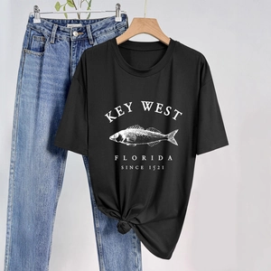 Detail of vintage Key West fish print on a black crew neck short sleeve casual cotton T-shirt