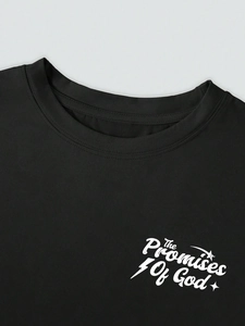 Detail of crew neckline and 'The Promises Of God' slogan print on black cotton t-shirt