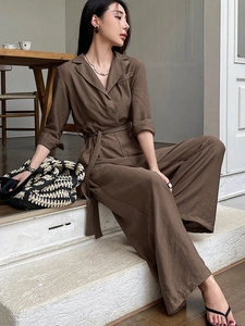 Elegant coffee brown v-neck wide-leg jumpsuit with long sleeves and waist belt
