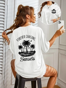 White short sleeve cotton t-shirt featuring sunset palm tree back print and front logo