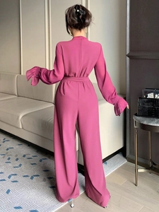 Combinaison élégante magenta à manches longues et jambes larges avec poignets à volants