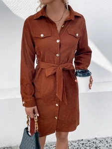Women's brown corduroy long sleeve dress with collar, buttons, and matching waist belt