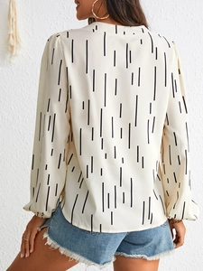 Back view of elegant lantern sleeve blouse with vertical black irregular stripes