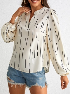 Detail of elegant V-neck striped blouse with lantern sleeves on a fashion model