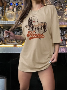 Women's khaki oversized T-shirt with Texas desert sunset graphic and crew neck