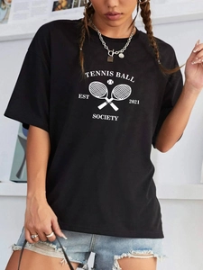 Detail of the white tennis ball society graphic print on this casual black cotton t-shirt