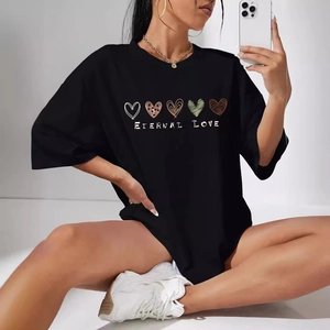Women's black oversized T-shirt with heart graphic and Eternal Love text print