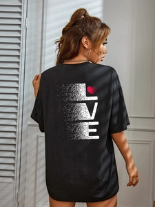 Detail of the oversized black t-shirt back featuring LOVE text and heart print