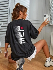 Detailed back view of oversized black T-shirt with gradient LOVE print and red heart