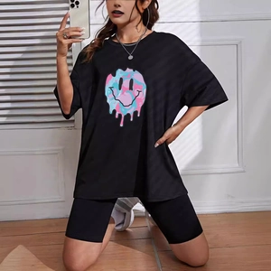 Women's oversized black T-shirt and biker shorts set with melting smiley face print