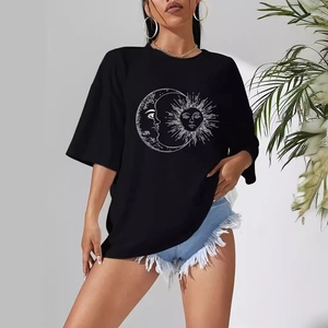 Women's black oversized T-shirt featuring a celestial sun and moon graphic print