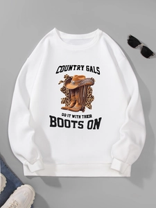 Detail of white long sleeve sweatshirt with country western graphic and ribbed cuffs