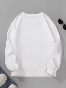 Flat lay of white crewneck sweatshirt showing ribbed collar and high-quality knit texture