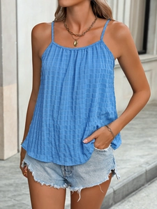 Detail of light blue halter top showing textured seersucker fabric and pleated neckline