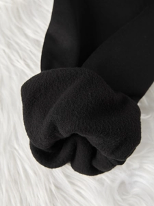 Detail of the thick black fleece lining and ribbed cuff on a long sleeve sweatshirt