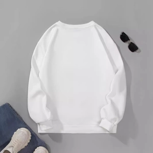 Women's classic white crewneck sweatshirt styled with denim jeans and casual shoes