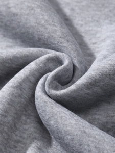 Close-up of grey marl heather fabric texture showing soft knit cotton blend material