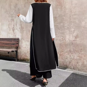 Women's chic black and white long tunic set with side slits and wide-leg pants