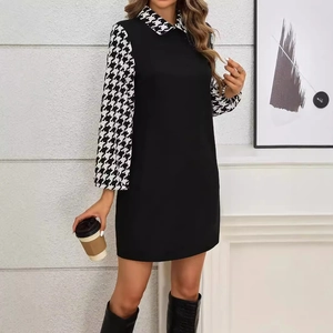 Elegant women's black dress featuring houndstooth lantern sleeves and a classic lapel collar