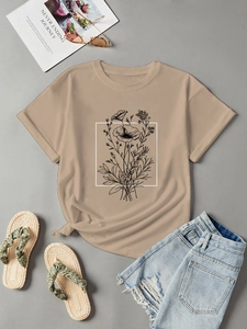 Close-up of floral print on khaki cotton t-shirt styled with summer holiday accessories