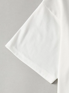 Close-up of double-needle stitching on the white cotton short sleeve T-shirt cuff