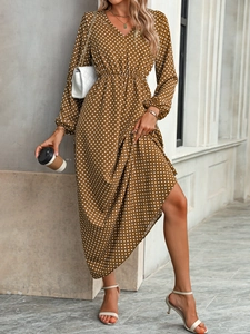 Detail of V-neck and puff sleeves on brown polka dot maxi dress for women