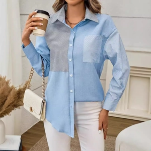 Minimalist light blue shirt with asymmetric stripe patchwork and front pocket design