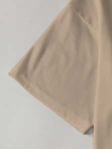 Detail of double-needle stitching on cuff and fabric of floral short sleeve t-shirt