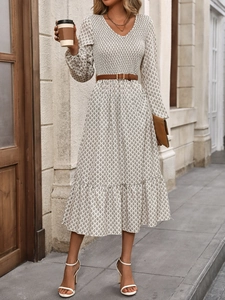Detail of elegant V-neck floral midi dress with smocked waist and brown leather belt