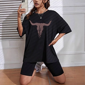 Women's black oversized t-shirt and biker shorts set with vintage bull skull print