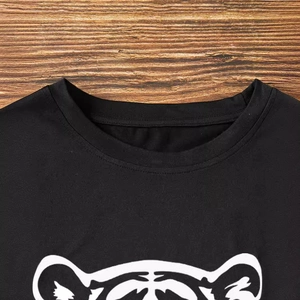 Women's black cotton t-shirt with white tiger graphic print and classic crew neck