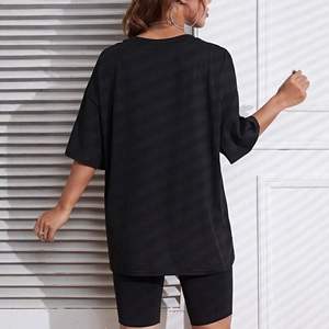 Women's black oversized cotton T-shirt and biker shorts set with a loose fit back view