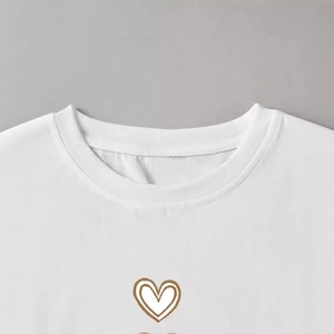 Women's summer white crewneck cotton t-shirt featuring a minimalist brown heart pattern