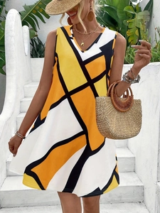 Detail of summer sleeveless midi dress featuring yellow and black geometric patterns