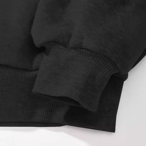 Black long sleeve shirt featuring ribbed cuffs and hem with high quality cotton knit texture