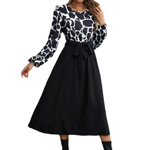 Elegant women's high-waisted dress with animal print top and flowing black A-line skirt