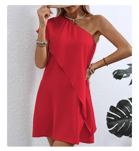 Detail of red one-shoulder dress with asymmetric ruffled layers and A-line vacation silhouette
