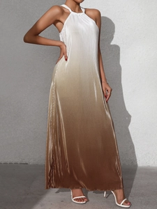 Detailed view of backless halter dress with micro-pleated gradient fabric and metallic sheen