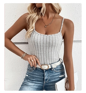 Detail of light grey ribbed knit camisole top with thin straps and textured fabric