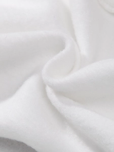 Macro shot of soft white fleece lining showing high-quality fiber texture and warmth