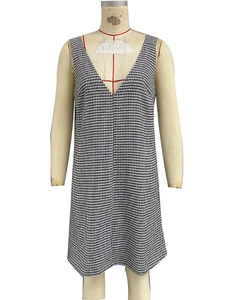 Detailed view of black and white houndstooth sleeveless dress with a classic V-neckline