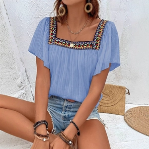 Light blue square neck boho top with colorful ethnic embroidery and puff sleeves