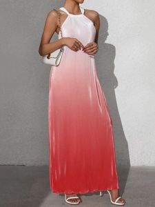 Detail of elegant gradient pleated fabric from white to coral red on a halter maxi dress
