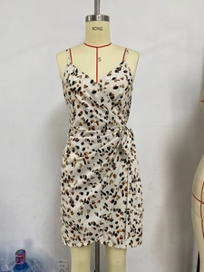 Detail view of floral leopard print wrap dress with side tie and thin straps