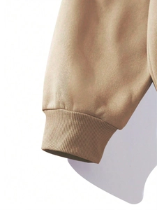 Detailed close-up of khaki sweatshirt ribbed elastic cuff with neat stitching texture