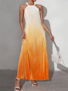 Detail of white and orange gradient halter maxi dress with fine vertical pleats