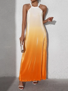 Detail of gradient orange halter dress with elegant pleated texture and flowing design