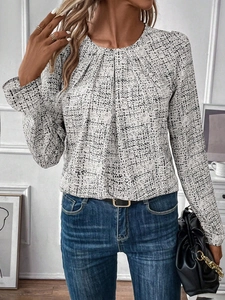 Detail of the elegant ruched neckline and plaid pattern on this long sleeve blouse