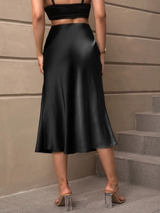 Elegant black satin midi skirt with silky glossy fabric and a high-waisted A-line fit